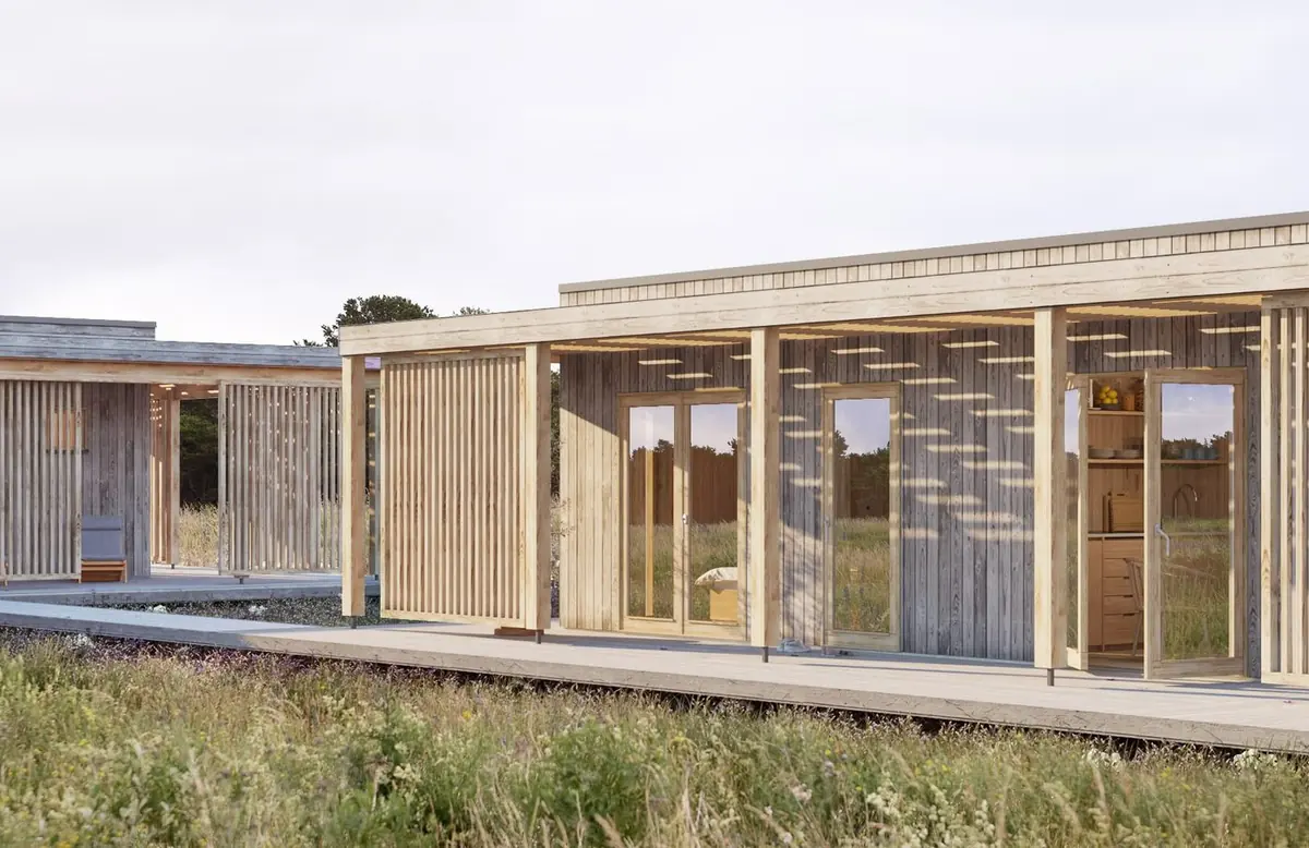 Visualisering: arkitektritat fritidshus från Öbo Hus med altan i ett ängslandskap